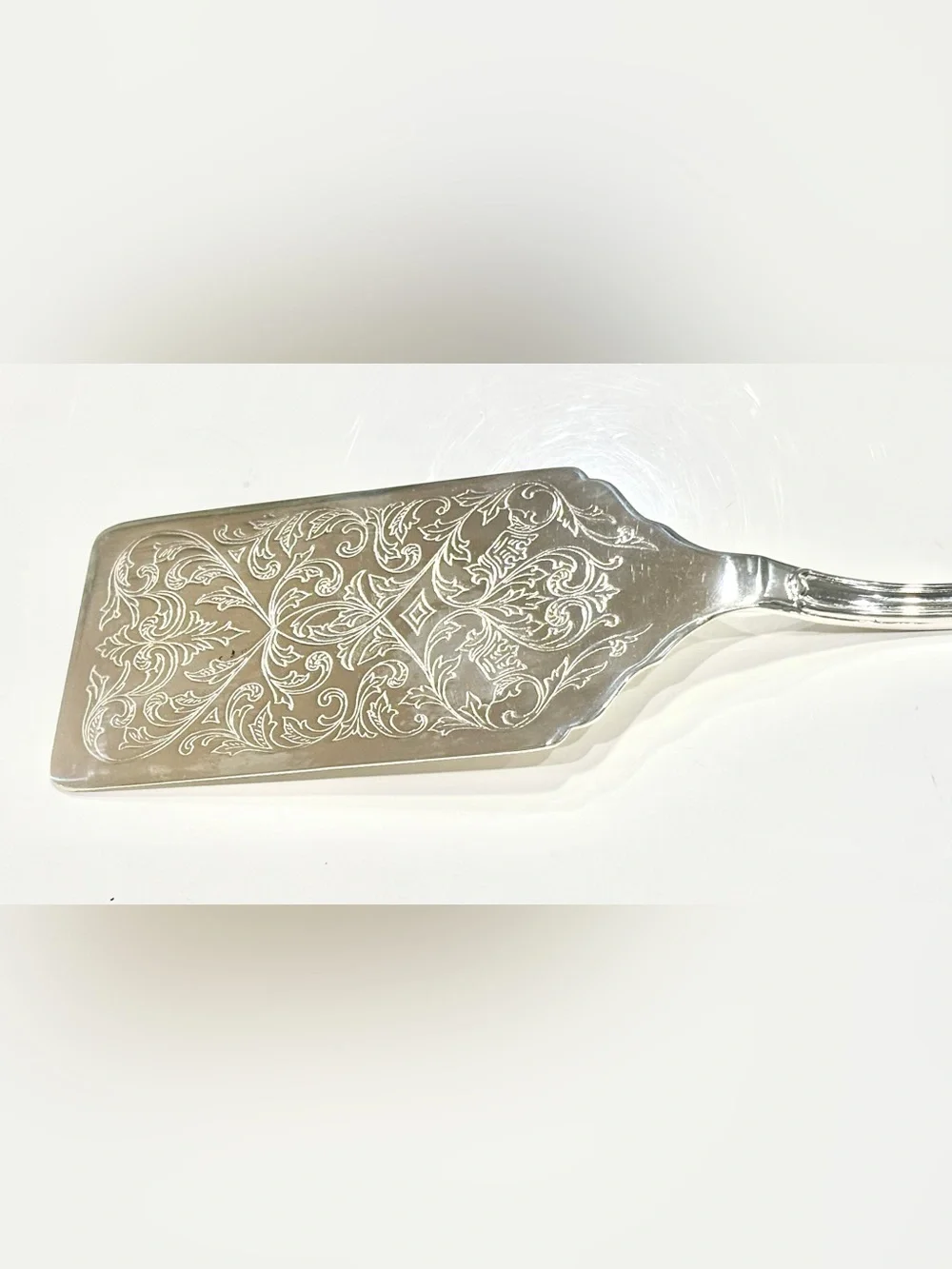 Vintage Polished Silver-Plated Server with Ornate Engraved Details